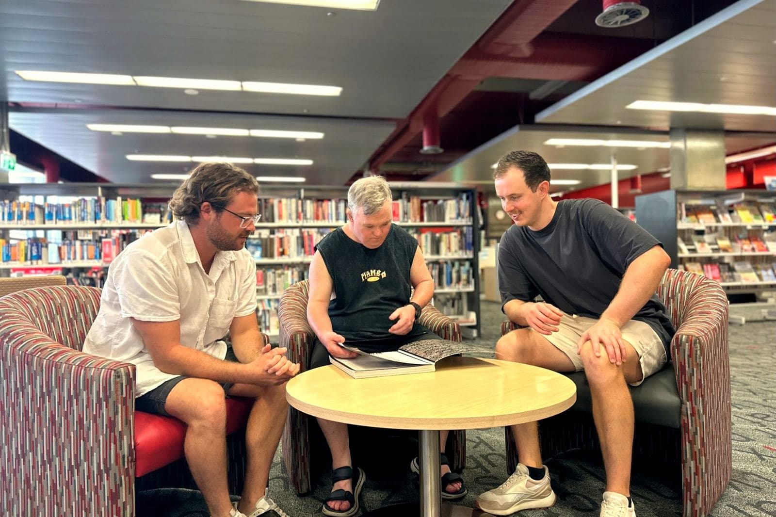 An Abound participant with members of the support team