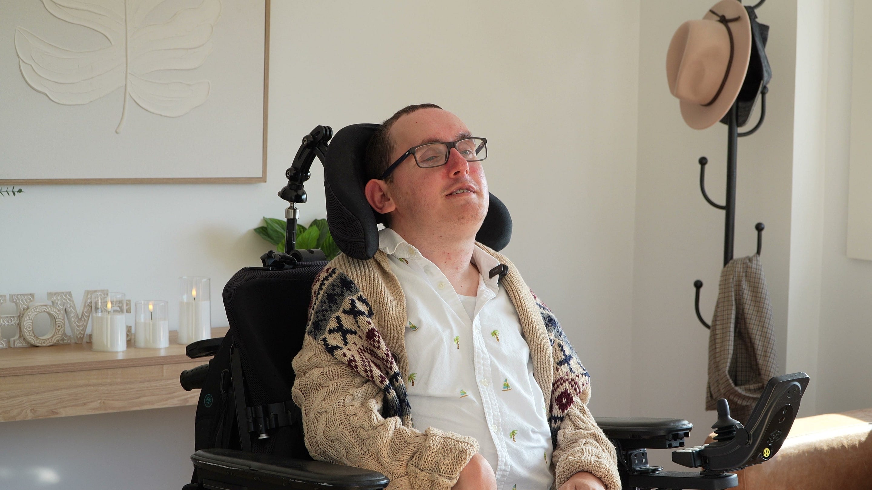 A wheelchair user in a bright living room